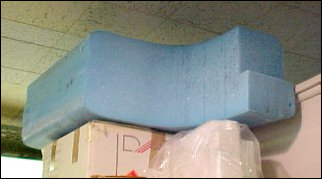 It's important to keep the actual collectors clean, thus the saran wrap. Out in the field, saran wrap is impractical for use, and so they actually use this blue foam at right. The blue foam is transparent to radio waves, and keeps stuff out.