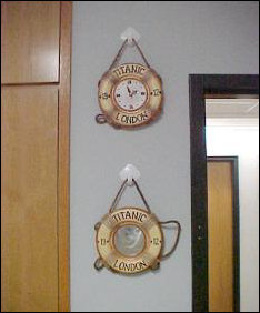 Remember these from last year? They're back with a vengeance. Clock, mirror, hooked to the wall with stick-on hooks from Wal-Mart.