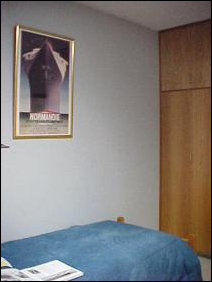 Right over the bed is Normandie... funny... the Normandie capsized during World War II, and last year, interestingly enough, towards the end of the year, my Normandie picture of all things fell off the wall. We hope that this year, the incident isn't repeated.