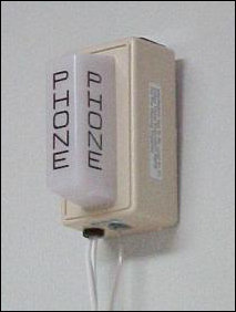 The phone strobe is a Wheelock PS-11A-WPW. It operates on house current, and has a 75 candela strobe. It is activated directly off the phone line, emitting three to four flashes per ring. I bought it on eBay in order to be awakened by the phone in the event I am needed at an odd hour. A side benefit is that it's found to be quite interesting by nearly everyone in Potomac Hall.