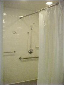 This shower is unique on the floor, as it's handicapped-accessible. Only problem is that the shower-head won't stay up too well... it's kind of a position-and-pray kind of deal.