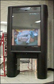Among other things, we discussed how annoying this thing is. I had them both beaten on that one, as I remembered that during my freshman year, when that thing was new, it made sound, too. I was reading the newspaper in here one day and that thing was going on and on, and so I just walked up, reached over to the wall, and then pulled swiftly, and all of a sudden, that machine was silent, the screens were dark, and the plug was on the floor. And I was darn proud of myself. JMU has since learned to put a vending machine in front of it if they don't want people to unplug it. Among other things, we discussed how annoying this thing is. I had them both beaten on that one, as I remembered that during my freshman year, when that thing was new, it made sound, too. I was reading the newspaper in here one day and that thing was going on and on, and so I just walked up, reached over to the wall, and then pulled swiftly, and all of a sudden, that machine was silent, the screens were dark, and the plug was on the floor. And I was darn proud of myself. JMU has since learned to put a vending machine in front of it if they don't want people to unplug it.