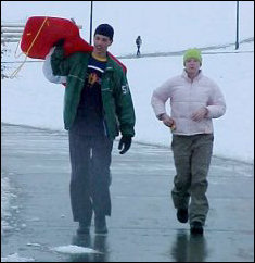 Now, here come Raleigh and Lindsay from Potomac to join in the sledding! Raleigh brought a real sled, believe it or not, which made this the most sophisticated piece of sledding equipment that there was.