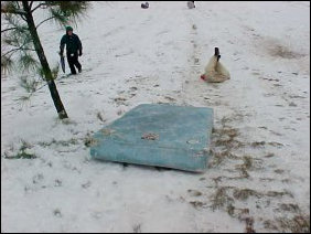 Meanwhile, other people tried to take a large blue mattress and use it for sledding. The raw mattress, unfortunately, did not work. It stopped, and sent its occupant on ahead.
