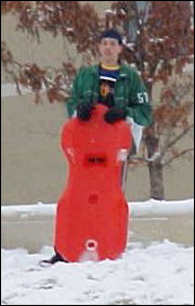 While the mattress-people did that, Raleigh and Lindsay got up the hill above the sidewalk, and sledded down that into the sidewalk.