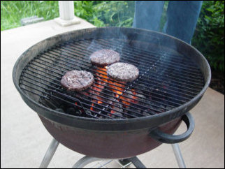 And more hamburgers cook on the grill... And more hamburgers cook on the grill...