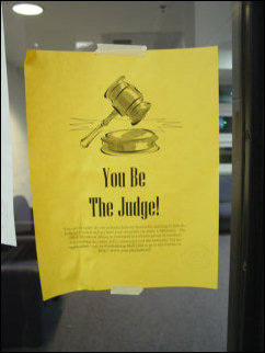 A number of us pondered this advertisement, which, after watching enough TV over the weekend, started to take on a Judge Judy-style "Here comes the judge!" ring. A number of us pondered this advertisement, which, after watching enough TV over the weekend, started to take on a Judge Judy-style "Here comes the judge!" ring.