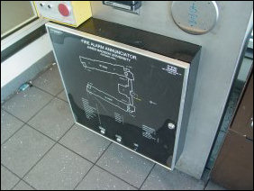 The fire panel didn't fare too well in the incident, as the sprinkler head in question was right above it. You can see that the graphic annunciator took on some water. It actually took on enough to short-circuit, necessitating disconnecting it. Here, though, you can see the amount of water in the front of it...