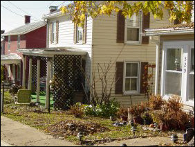 Most of the Old High Street neighborhood is single-family residential (above), though there is some high-density residential (below left), consisting of apartments where parking has replaced the front yard, and also medium-density residential (below right), in the case of this duplex where there is a couch in front of one of the entrances (strange, don't you think?). Most of the Old High Street neighborhood is single-family residential (above), though there is some high-density residential (below left), consisting of apartments where parking has replaced the front yard, and also medium-density residential (below right), in the case of this duplex where there is a couch in front of one of the entrances (strange, don't you think?).