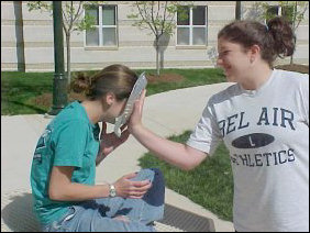 PIED!  There was a "Pie your hall staff" program on the Sunday before finals, and here the two Amys get it - right in the face.