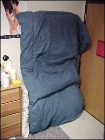 Mattress, comforter, and pillow, all freshly pulled off the loft, were removed and placed aside for the time being.  Made entry and exit rough, but it worked.