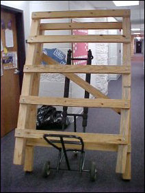 Mecca, being the wonderful person she is, let me use the chair-dolly things from downstairs to carry the stuff out.  It worked out nicely, but the loft parts were just a hair too wide to get past the suites in the center of the hallway.