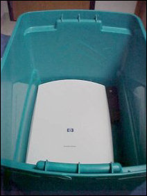 First thing to get packed is the less-necessary computer parts.  A scanner is by no means essential, and so into the box it goes!