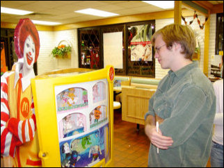 Meanwhile, Spencer ponders the navel of the universe while looking at the Happy Meal toys. Meanwhile, Spencer ponders the navel of the universe while looking at the Happy Meal toys.