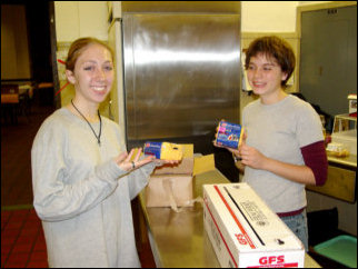 Mary and Maggie strike a "cheesy" pose while helping prepare the food for lunch. Mary and Maggie strike a "cheesy" pose while helping prepare the food for lunch.
